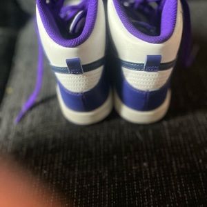 Purple and white Nike dunk gently used